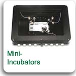 Miniature incubators for microscope stages